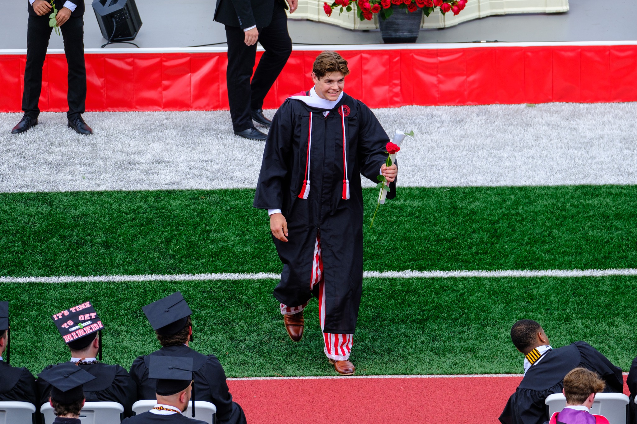 Jack Heldt ’23 is all smiles after receiving his Wabash diploma and rose.  