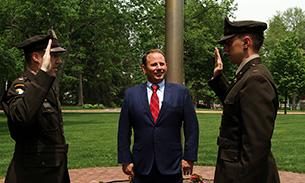 Wabash President Scott Feller (center) was present as Gross became the first Wabash graduate to be commissioned as a lieutenant in the U.S. Army after completing his ROTC training as part of a new comprehensive scholarship partnership.