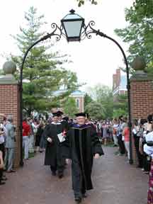 President White leads the graduates through the Senior Arch